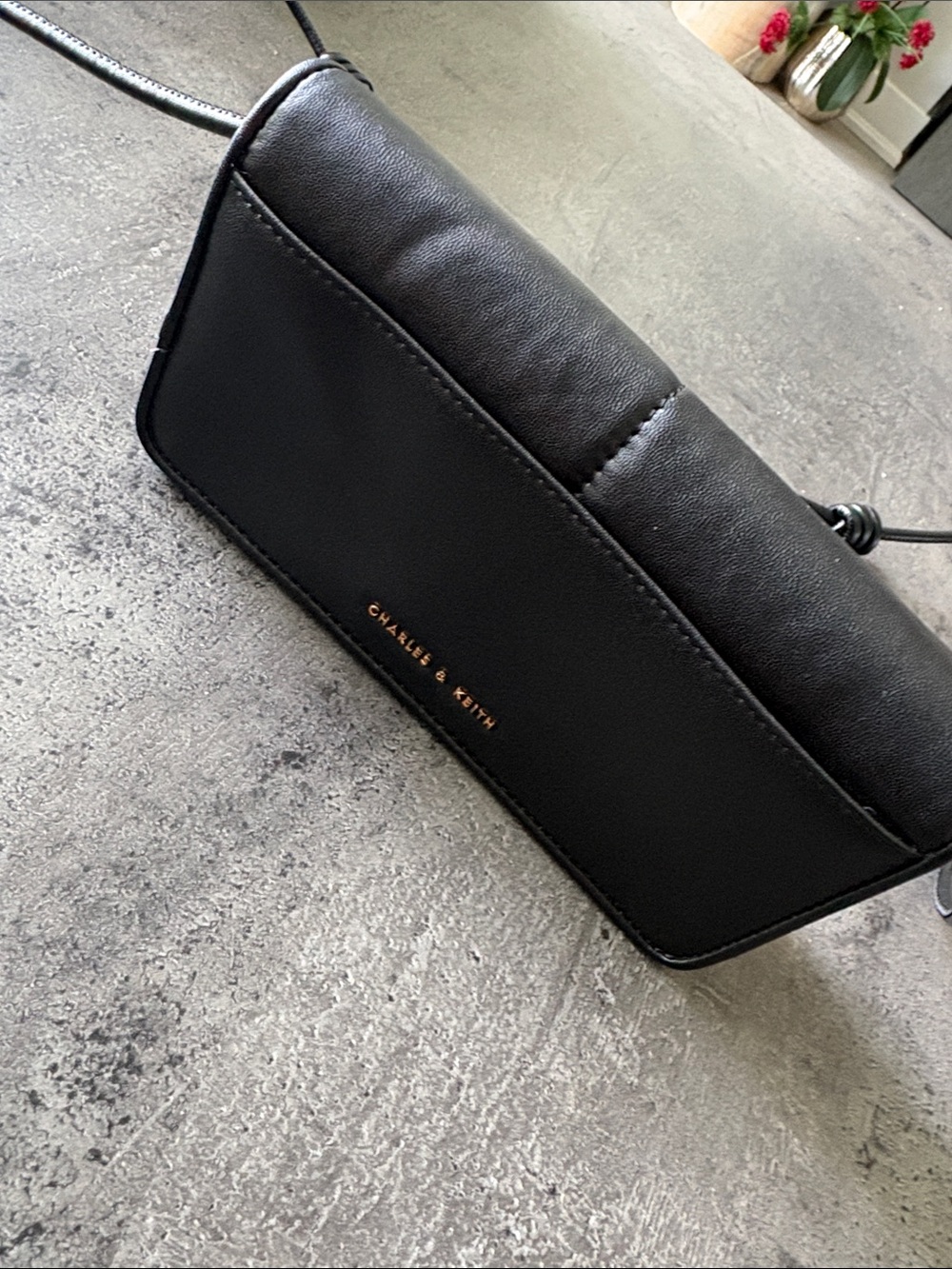 Charles & Keith Black Slim Crossbody Bag with Gold Logo